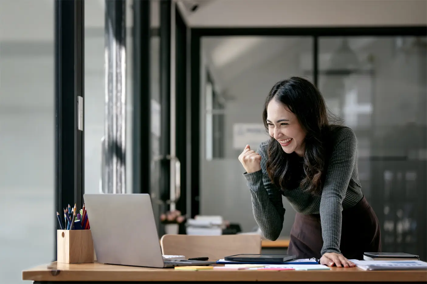 beautiful-asian-woman-celebrate-with-laptop-success