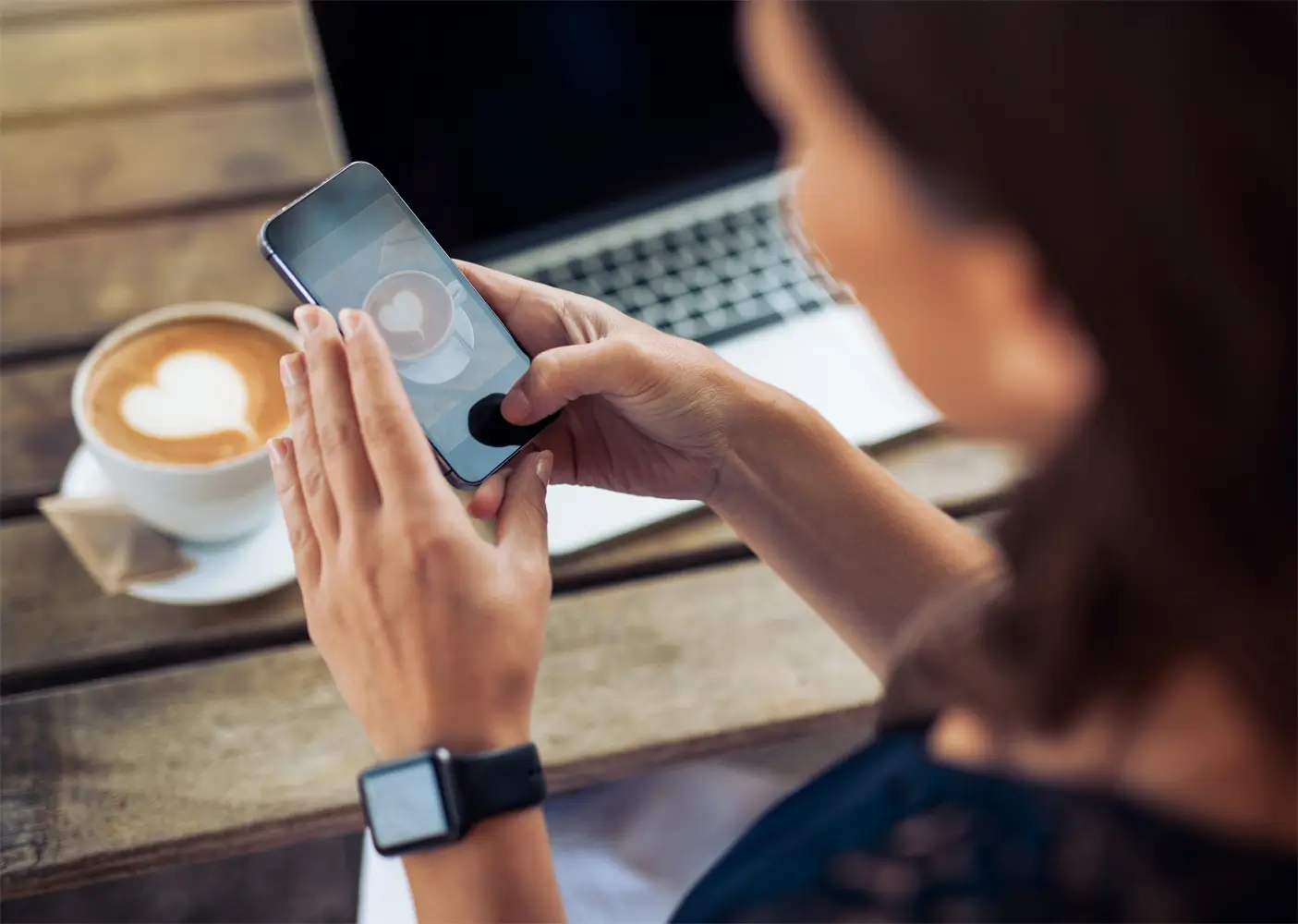 woman-taking-photo-of-coffee-with-smartphone